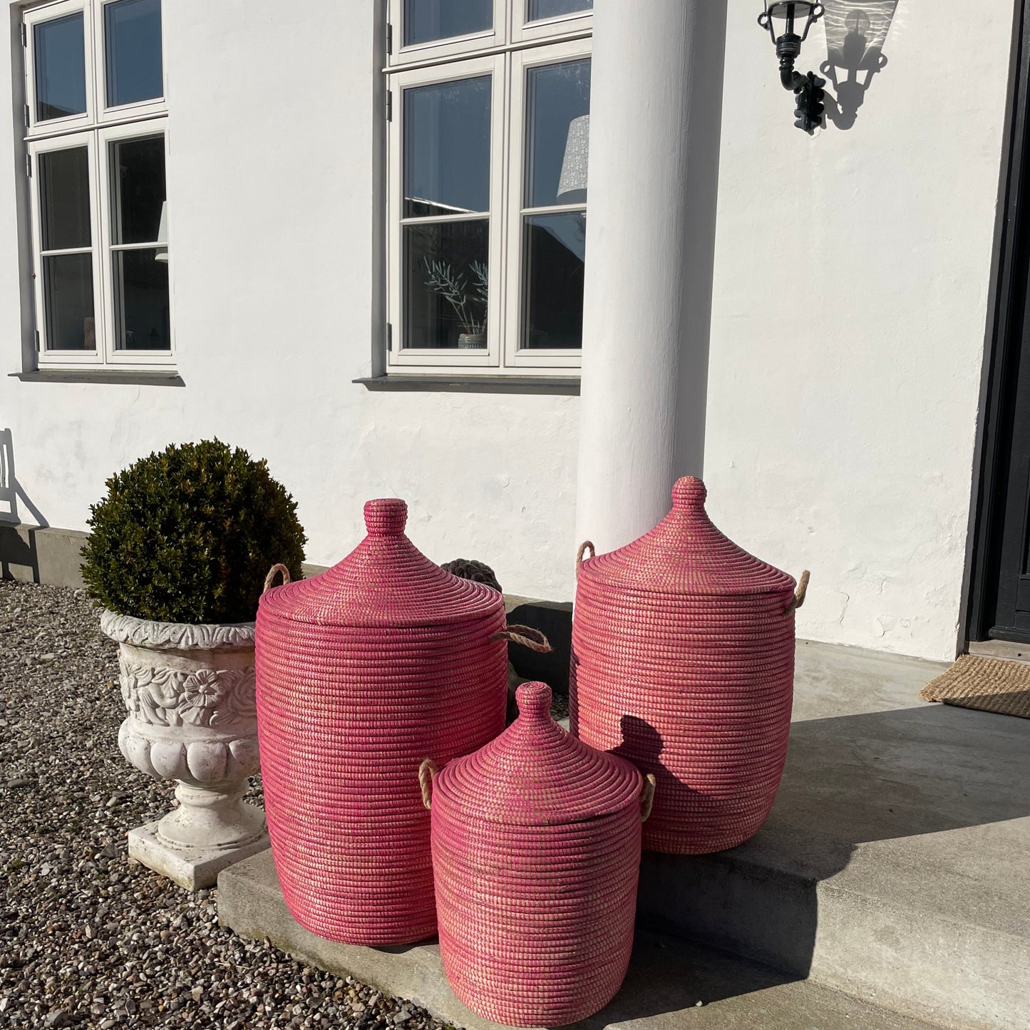 Raspberry colored laundry basket, hand braided with Senegal lid. Fair Trade