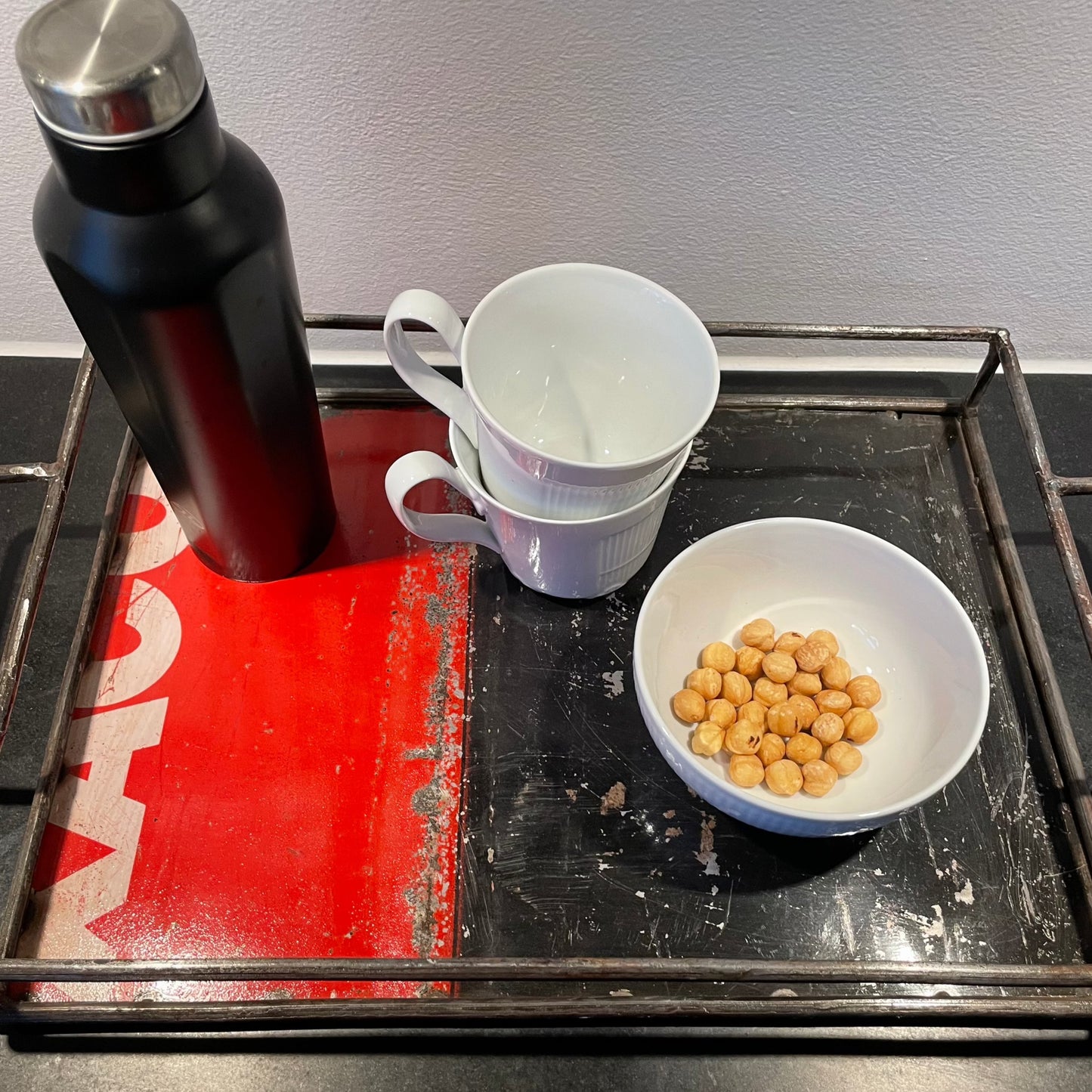 Serving tray in recycled metal. Handmade and Fair Trade from Burkina Faso