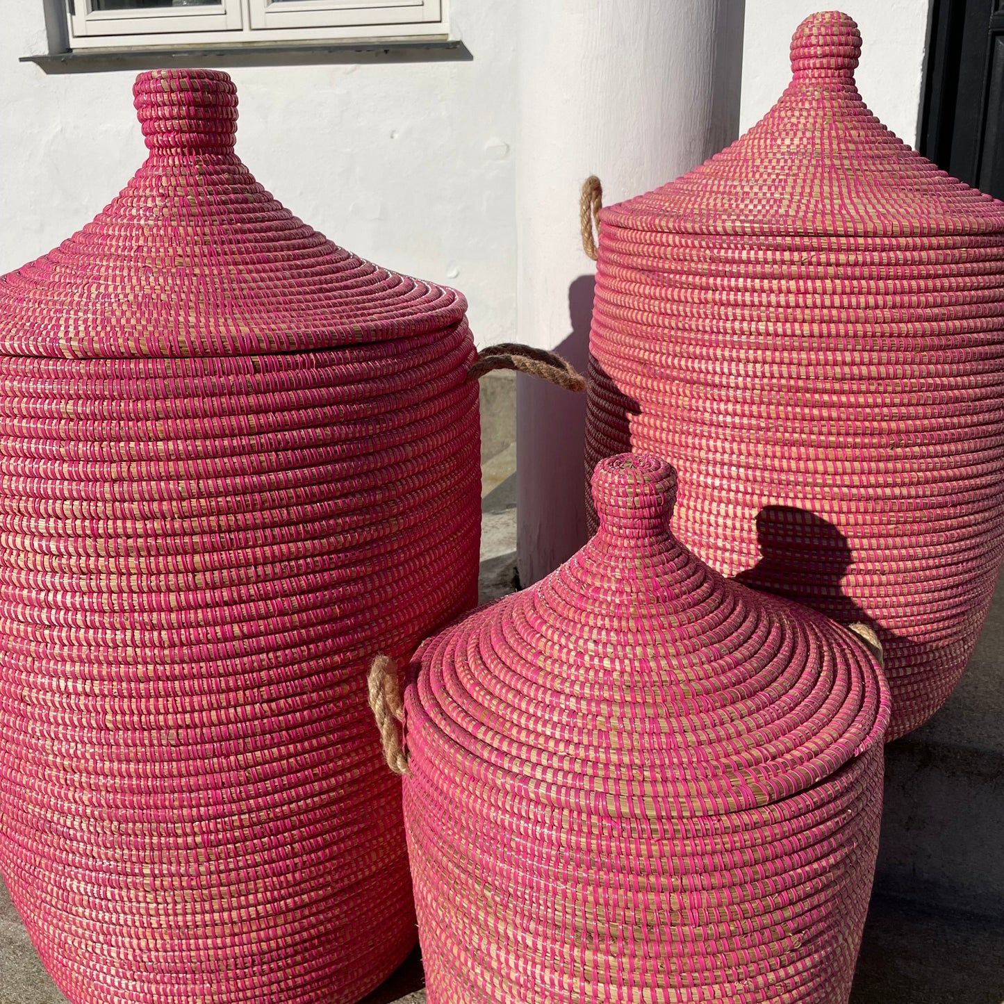 Raspberry colored laundry basket, hand braided with Senegal lid. Fair Trade