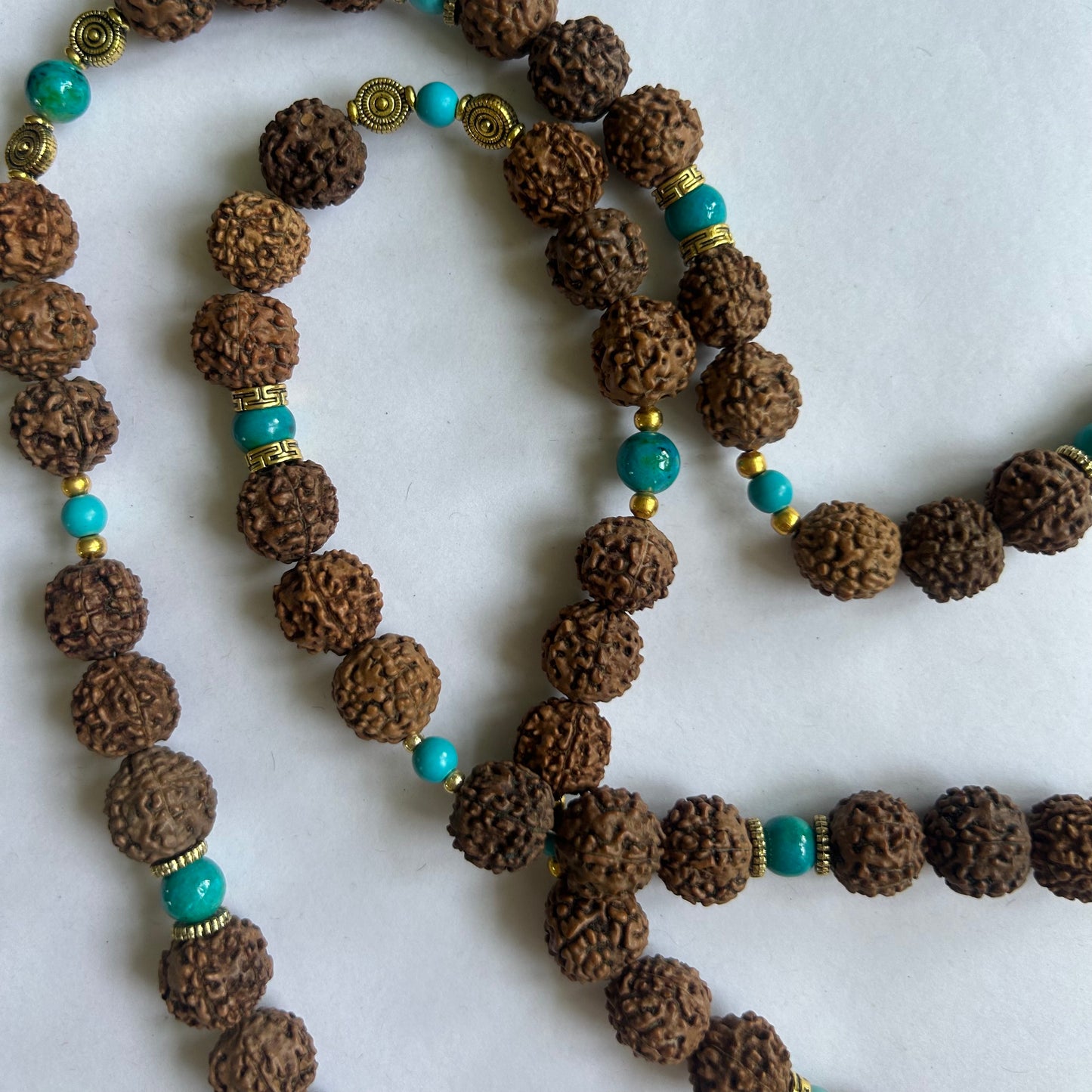 Mala pearl necklace, bean beads, turquoise pearl, gold plated links and a unique pendant