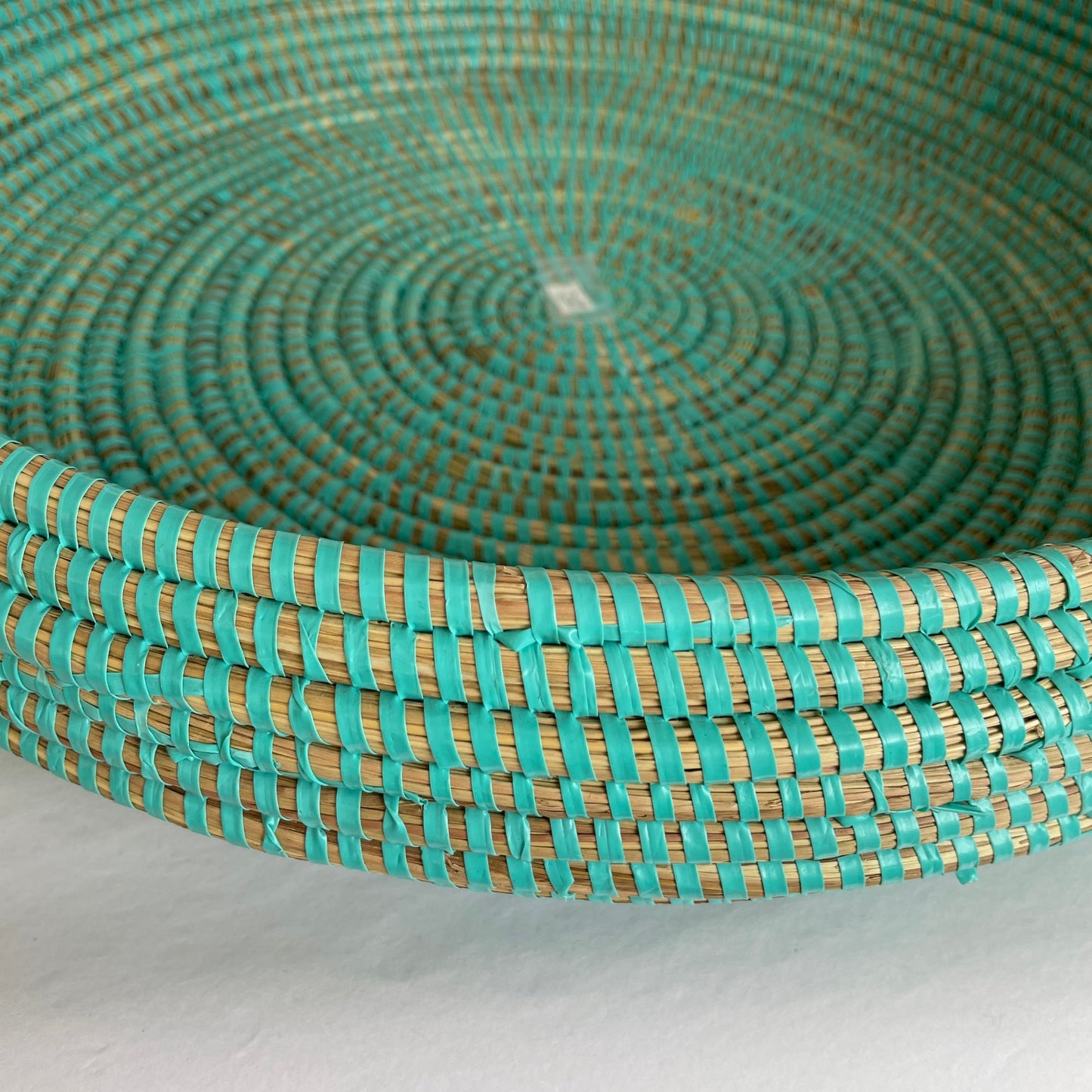 Bread basket / serving tray. Handwoven in elephant grass with recycled plastic thread. Three sizes. Turquoise. Fair Trade from Senegal