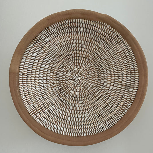 Wicker baskets for wall or table. Braided in elephant grass with leather or textile edging. Fair Trade from Senegal
