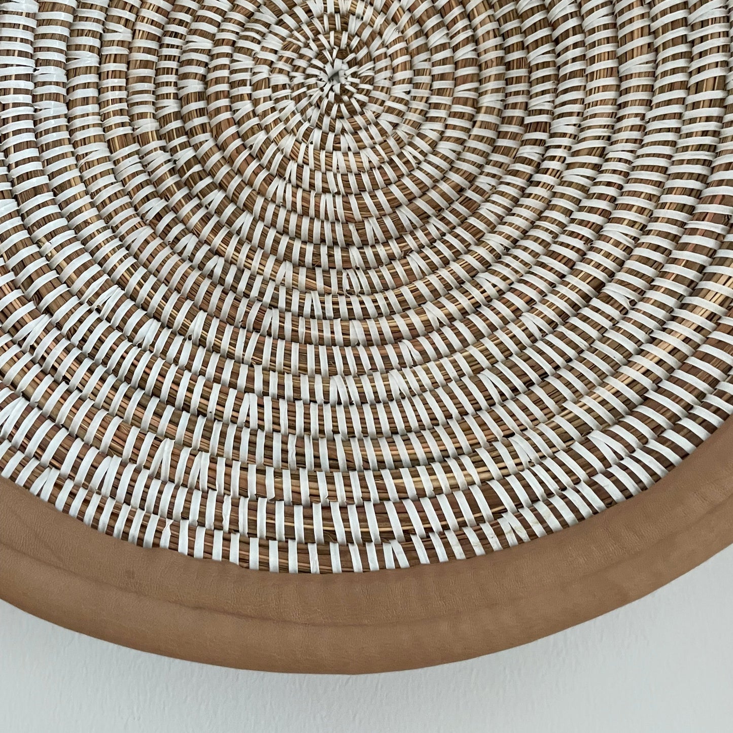 Wicker baskets for wall or table. Braided in elephant grass with leather or textile edging. Fair Trade from Senegal