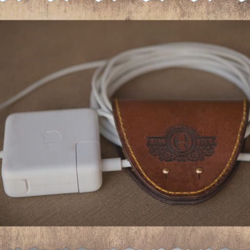 Mobile phone accessories, cord-collector in leather, South Africa