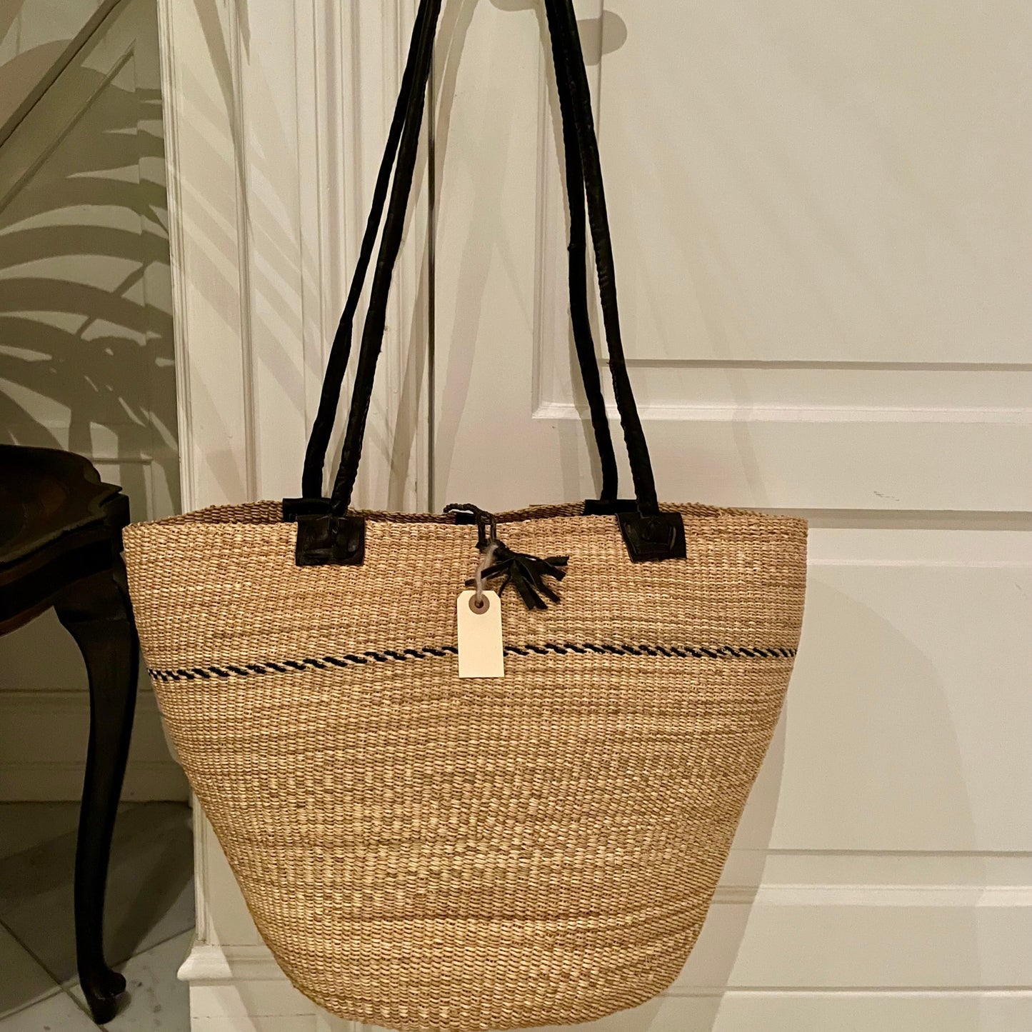 Beach bag hand-woven in elephant grass. Natural color with black leather handle. Fair Trade from Ghana