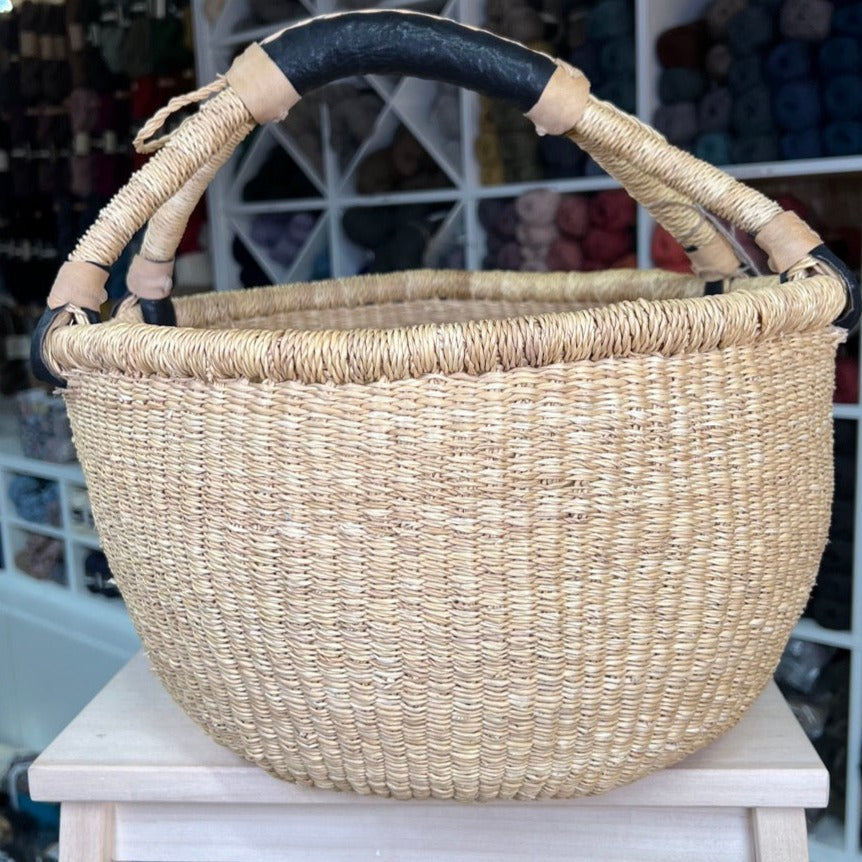 Bolga basket. Hand braided in three sizes. Nature colored with black leather handle. Fair Trade from Ghana