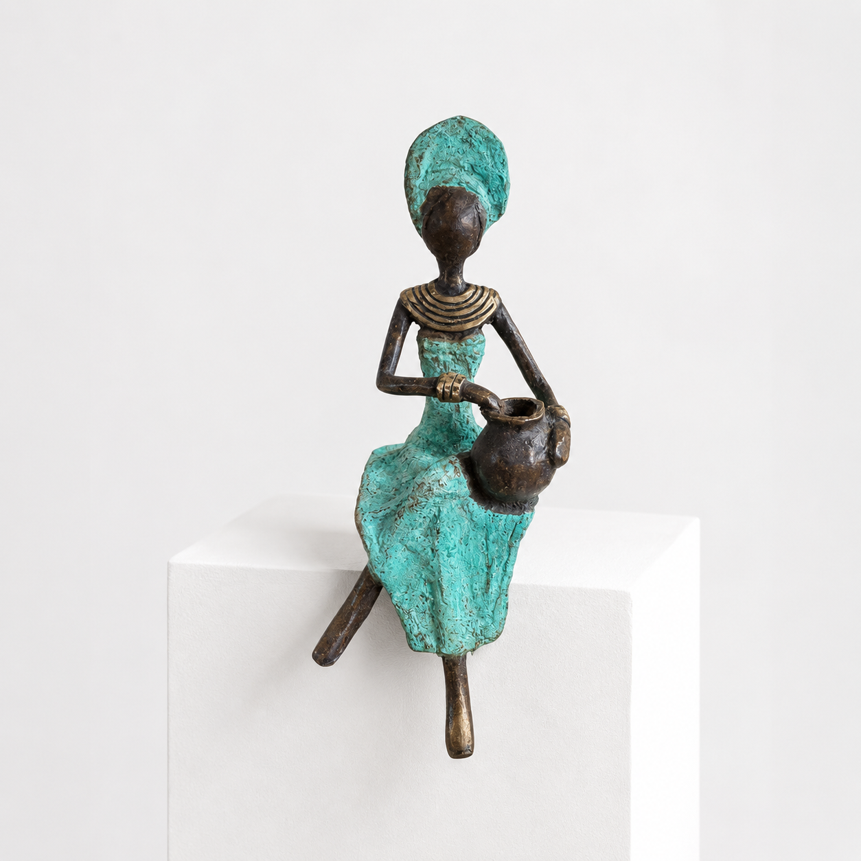 Sitting Woman – bronze sculpture, mint green dress, 15 cm