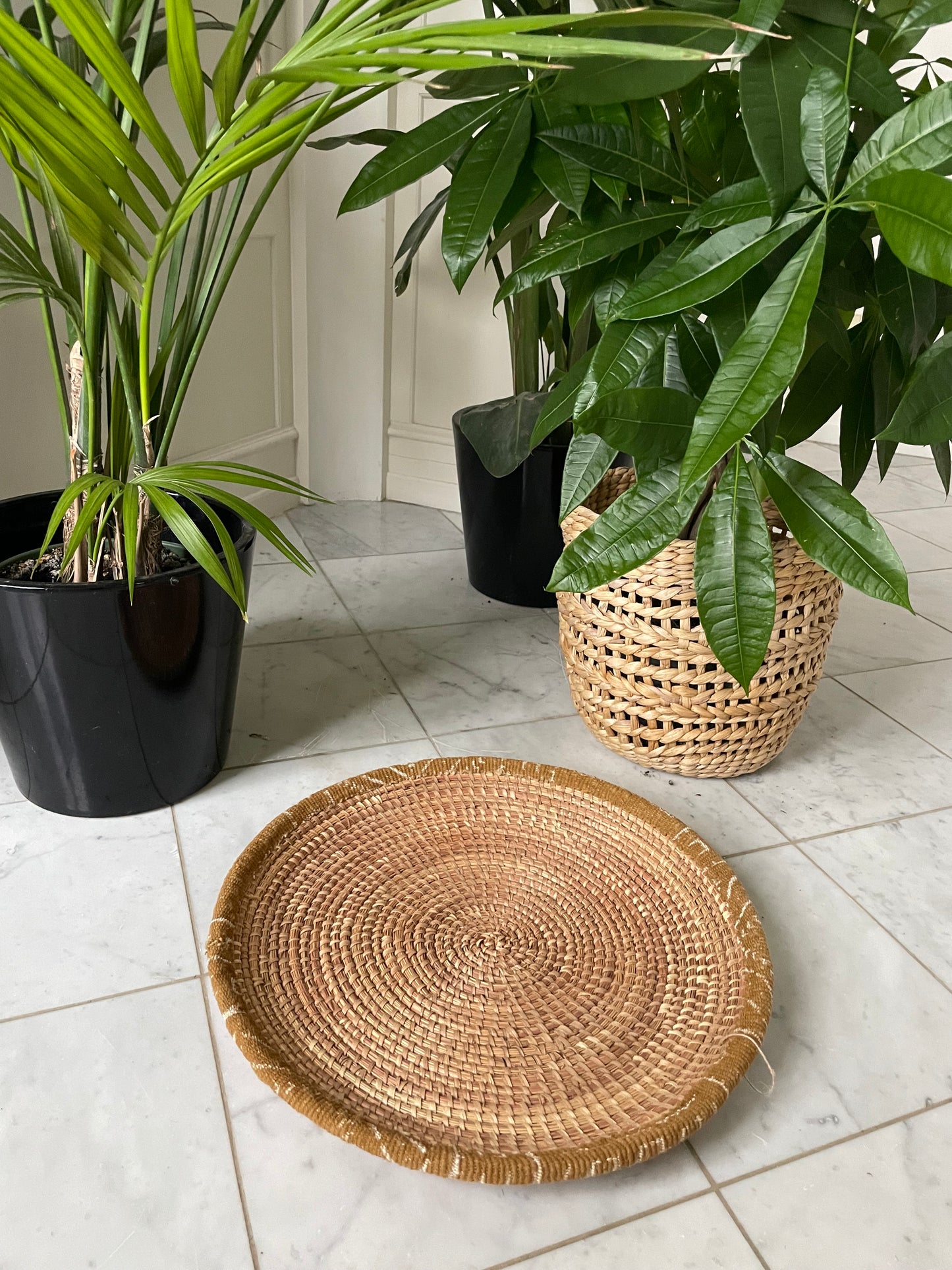 Wicker baskets for wall or table. Braided in elephant grass with leather or textile edging. Fair Trade from Senegal