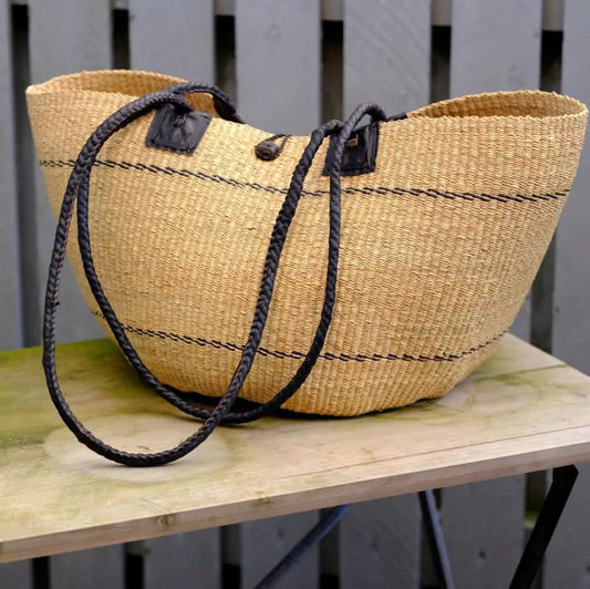 Beach bag hand-woven in elephant grass. Natural color with black leather handle. Fair Trade from Ghana