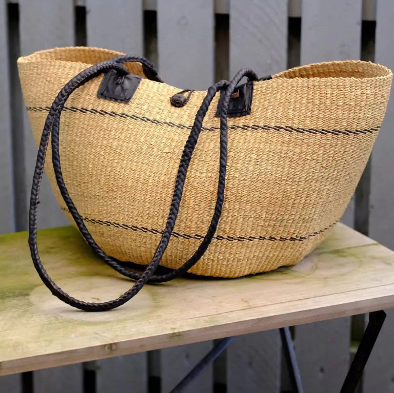 Beach bag hand-woven in elephant grass. Natural color with black leather handle. Fair Trade from Ghana