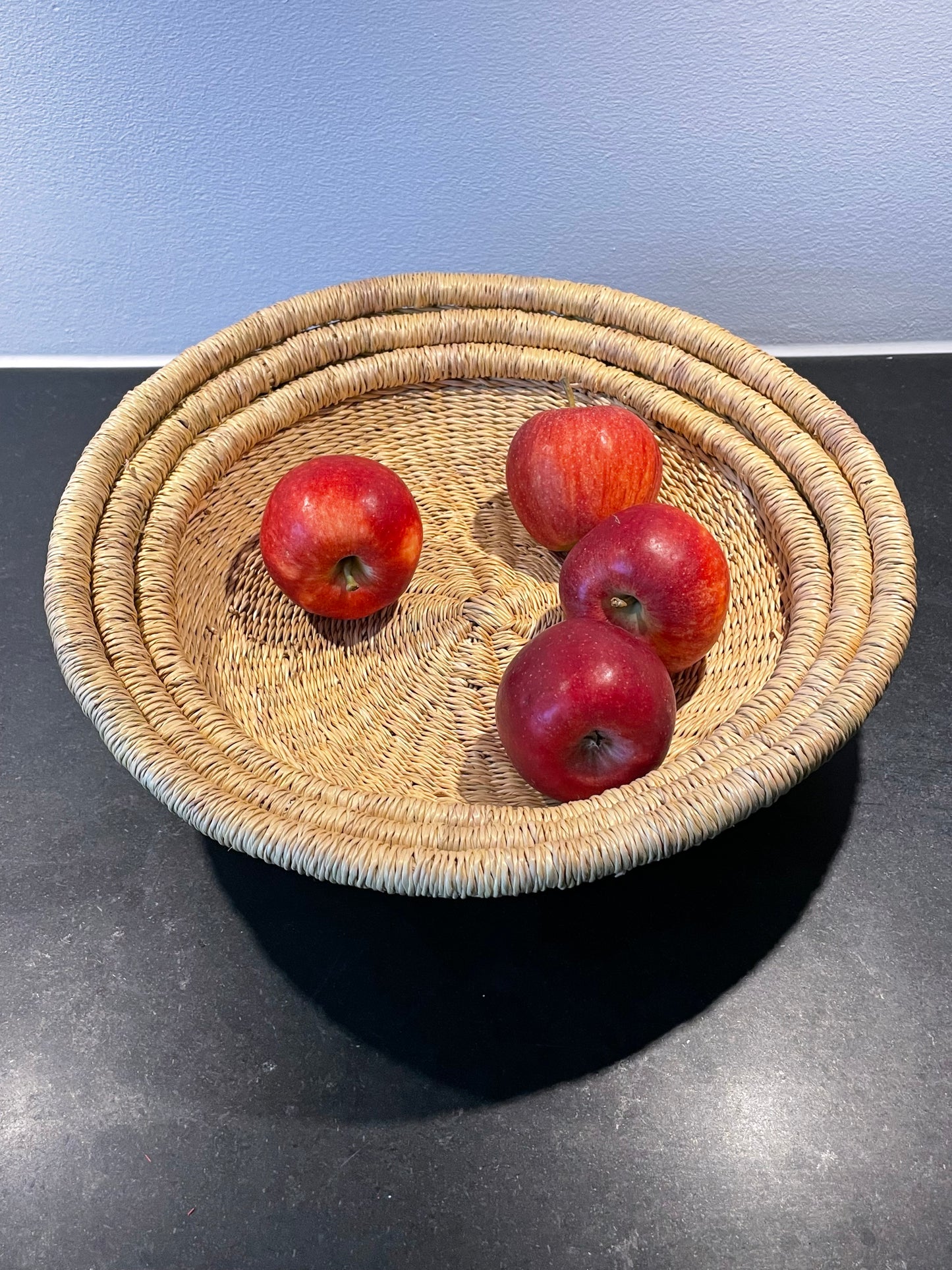 Bread tray, three colors and sizes. Woven in elephant grass. Fair Trade from Ghana
