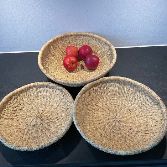 Bread tray, three colors and sizes. Woven in elephant grass. Fair Trade from Ghana